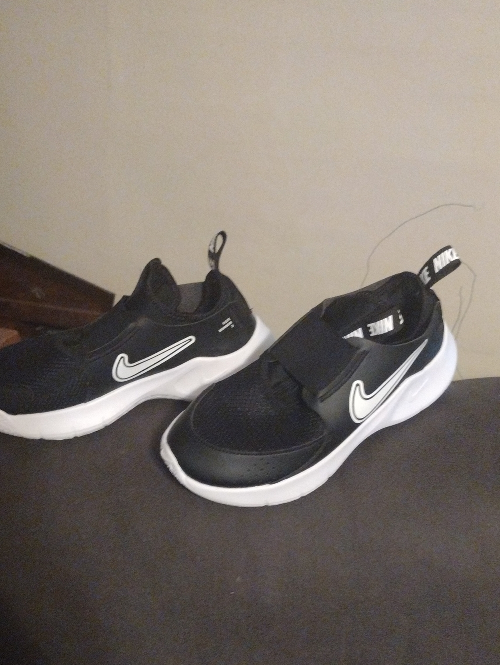 Nike Kids Black and White Slip-On Sneakers with Swoosh